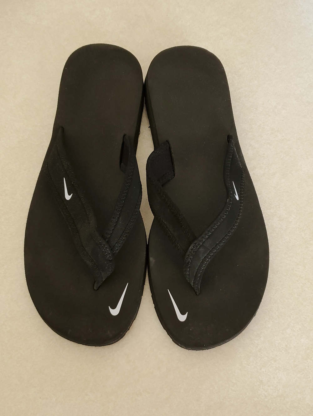 Nike Black Flip-Flop Sandals with White Swoosh Accents - Size 7
